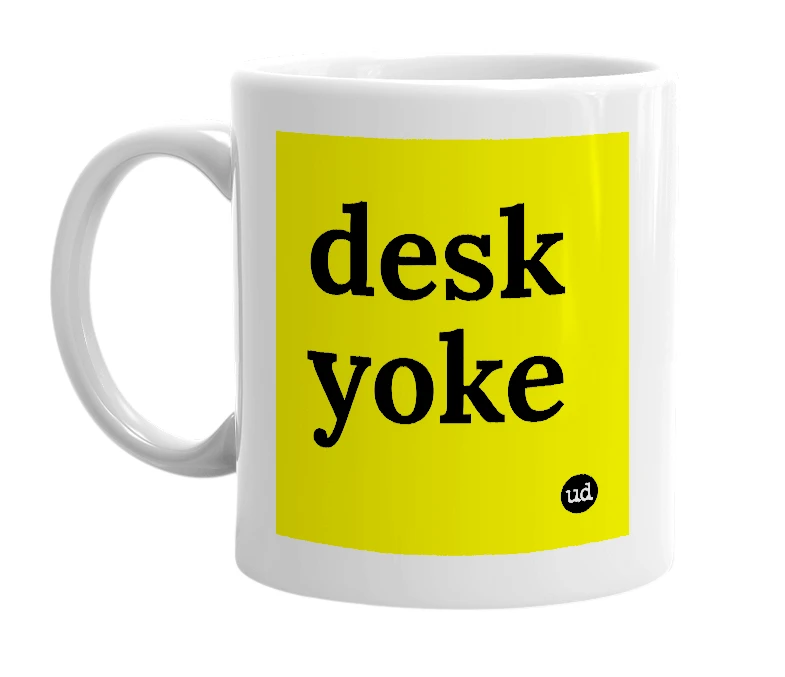 White mug with 'desk yoke' in bold black letters