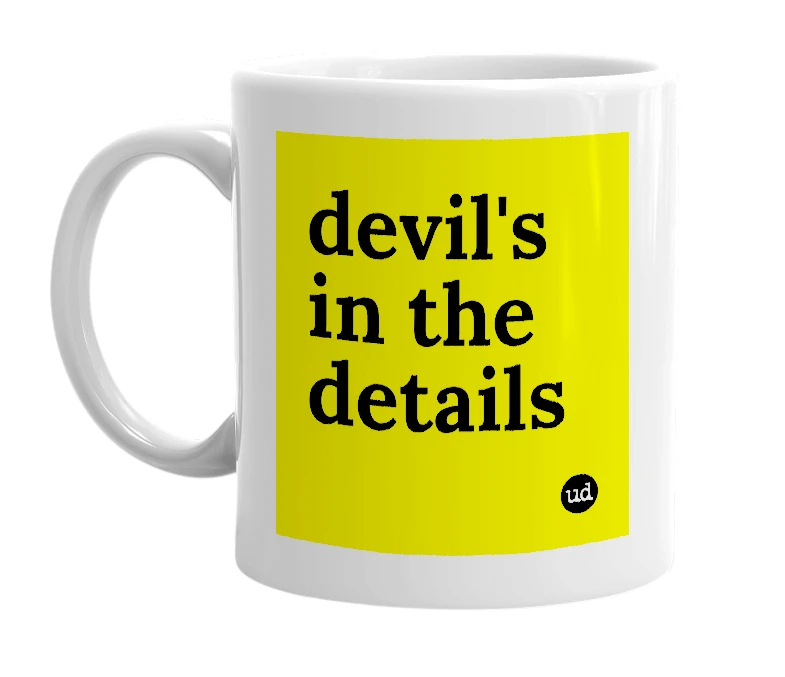 White mug with 'devil's in the details' in bold black letters