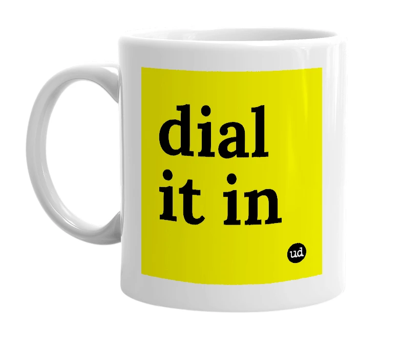 White mug with 'dial it in' in bold black letters