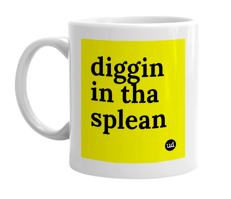 White mug with 'diggin in tha splean' in bold black letters