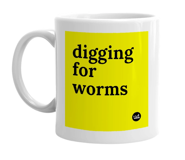 White mug with 'digging for worms' in bold black letters