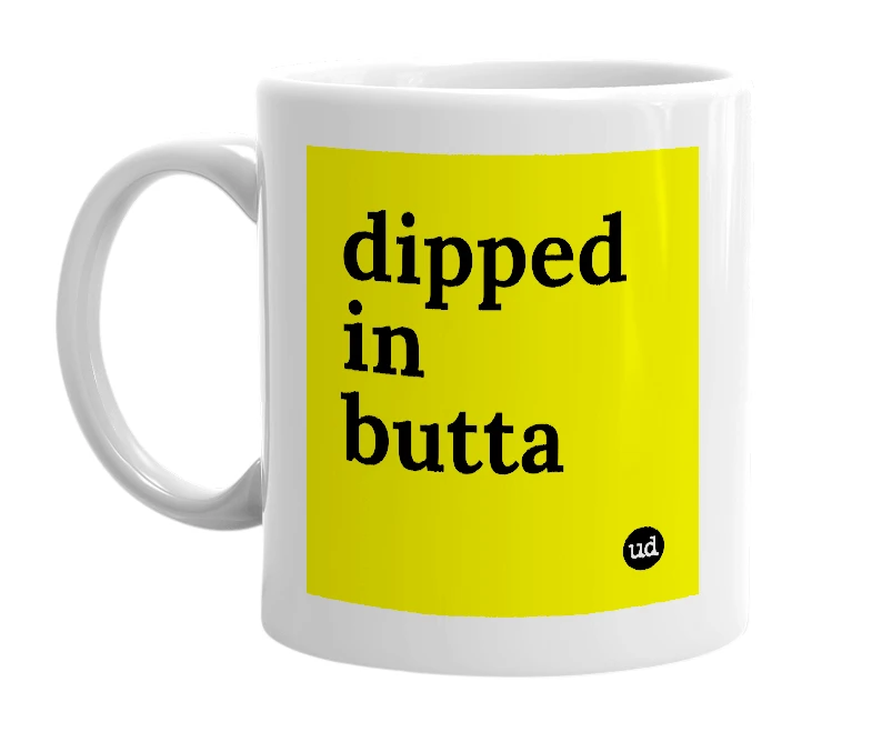 White mug with 'dipped in butta' in bold black letters
