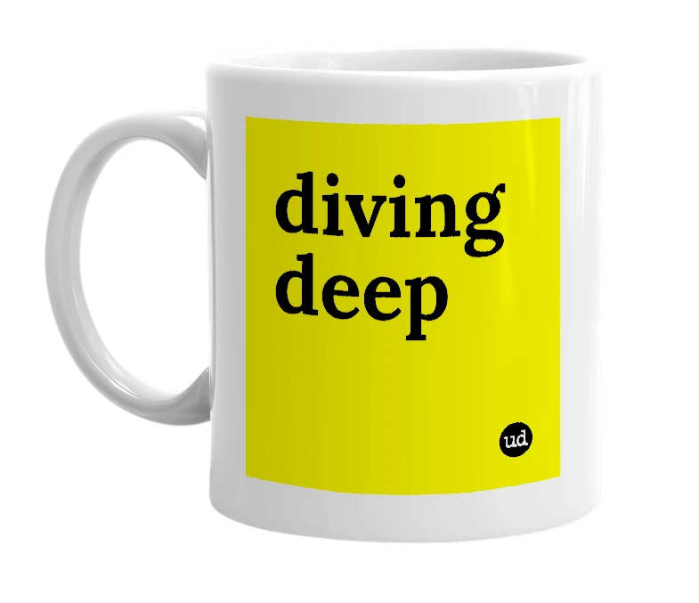 White mug with 'diving deep' in bold black letters