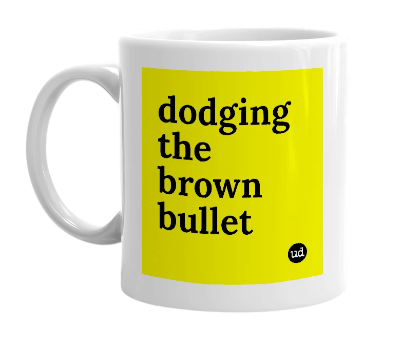 White mug with 'dodging the brown bullet' in bold black letters