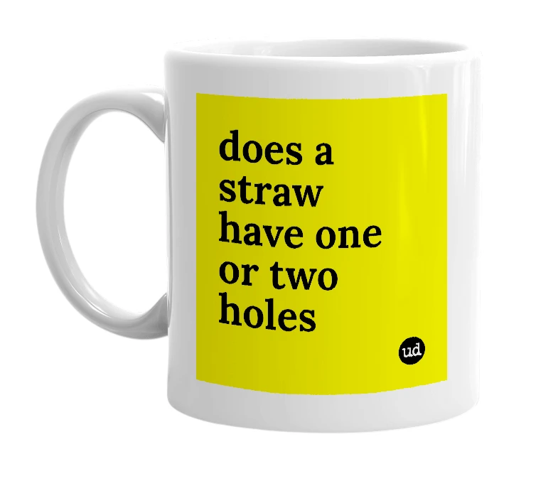 White mug with 'does a straw have one or two holes' in bold black letters