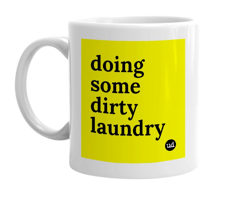 White mug with 'doing some dirty laundry' in bold black letters