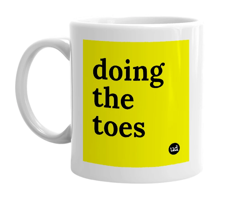 White mug with 'doing the toes' in bold black letters