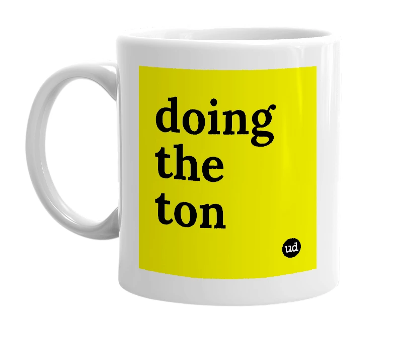 White mug with 'doing the ton' in bold black letters