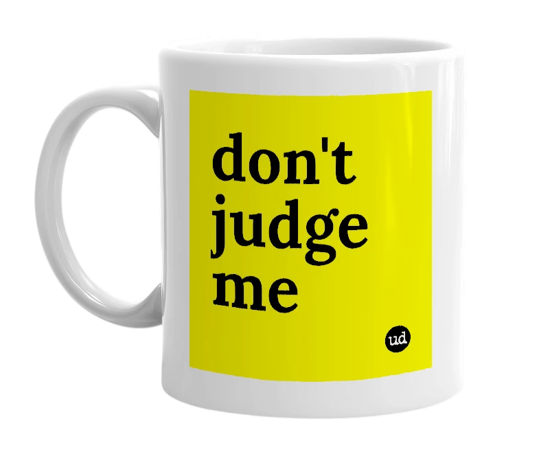 White mug with 'don't judge me' in bold black letters