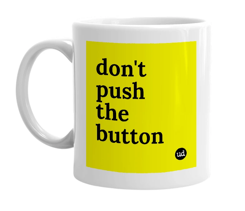 White mug with 'don't push the button' in bold black letters