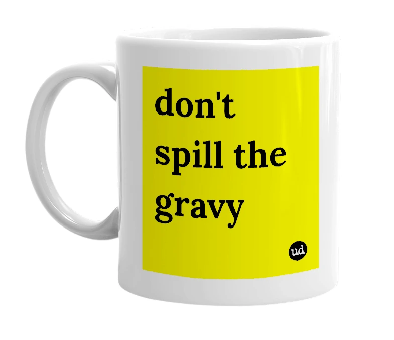 White mug with 'don't spill the gravy' in bold black letters