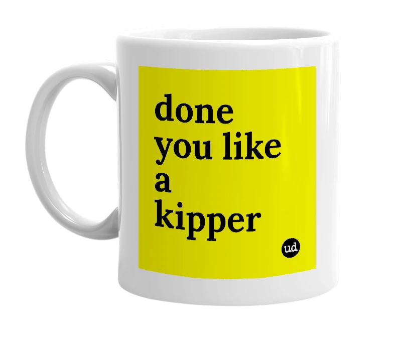 White mug with 'done you like a kipper' in bold black letters