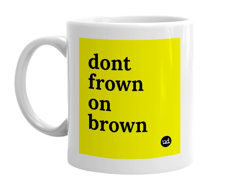 White mug with 'dont frown on brown' in bold black letters