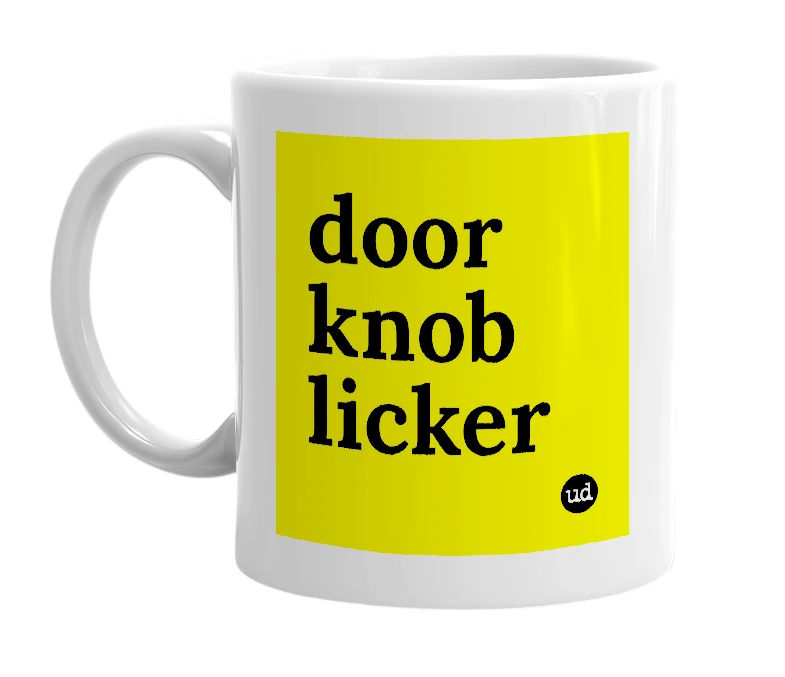 White mug with 'door knob licker' in bold black letters