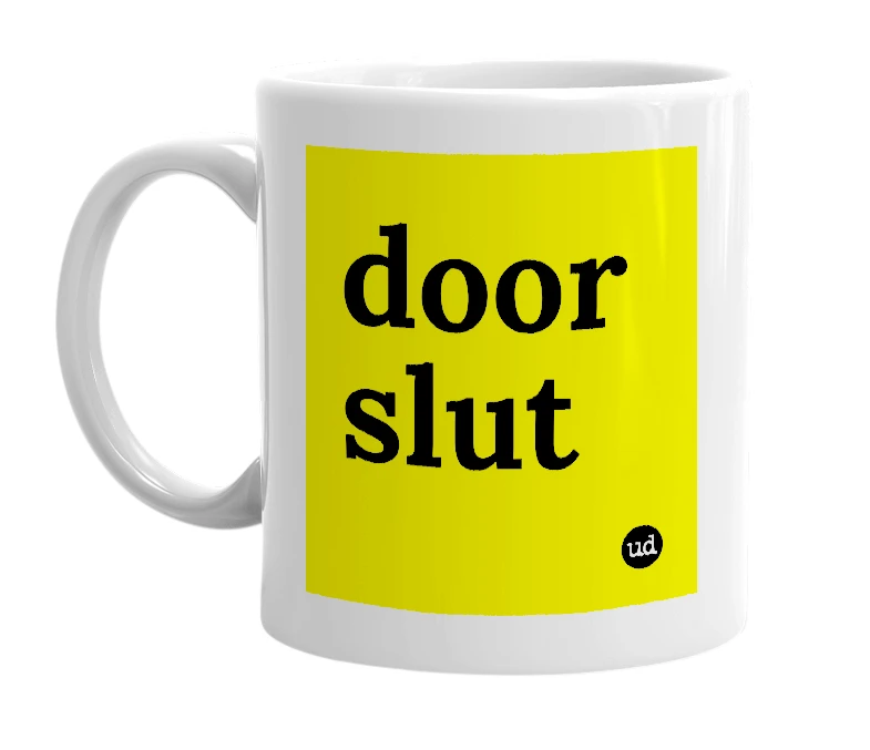 White mug with 'door slut' in bold black letters
