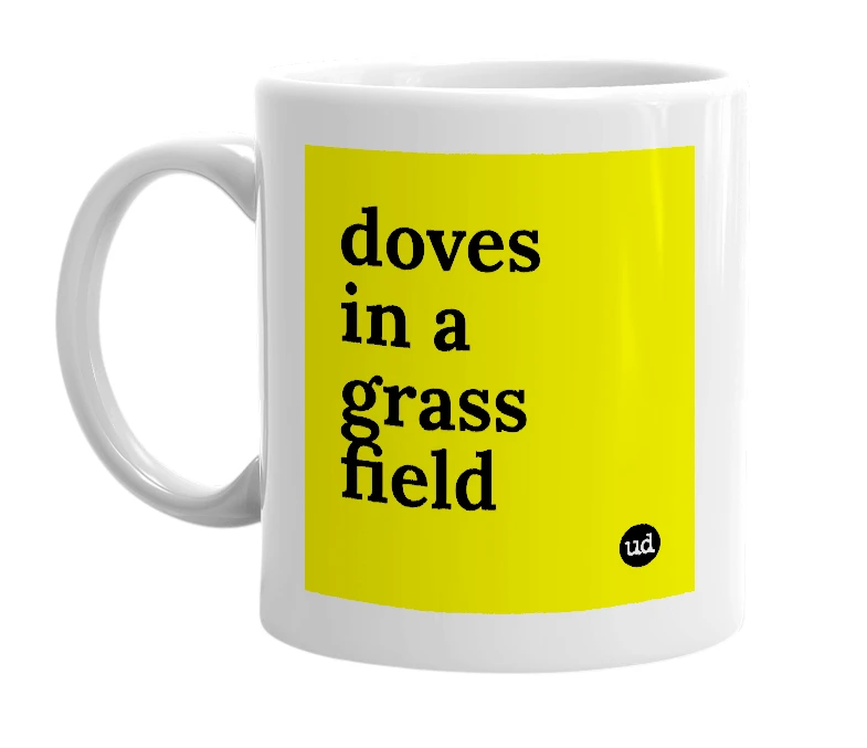 White mug with 'doves in a grass field' in bold black letters