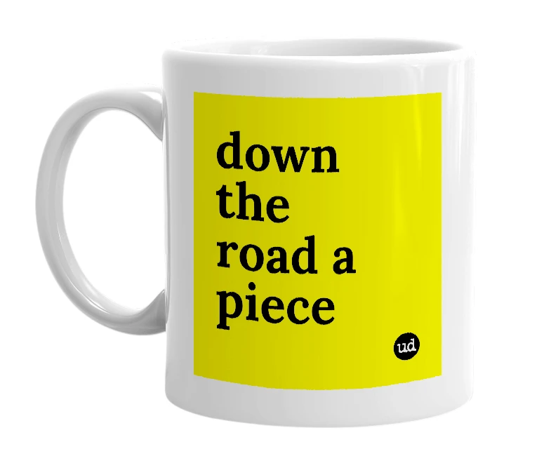White mug with 'down the road a piece' in bold black letters