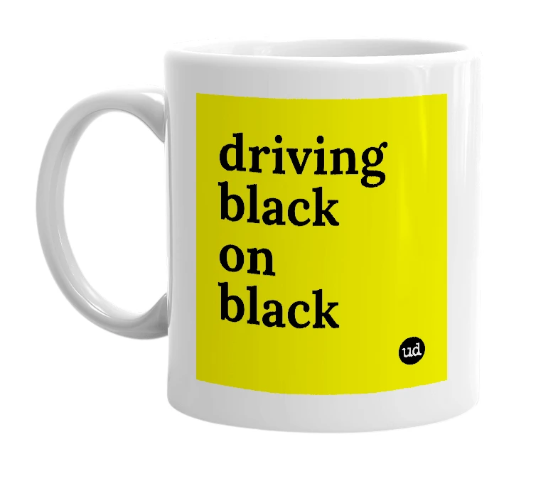 White mug with 'driving black on black' in bold black letters