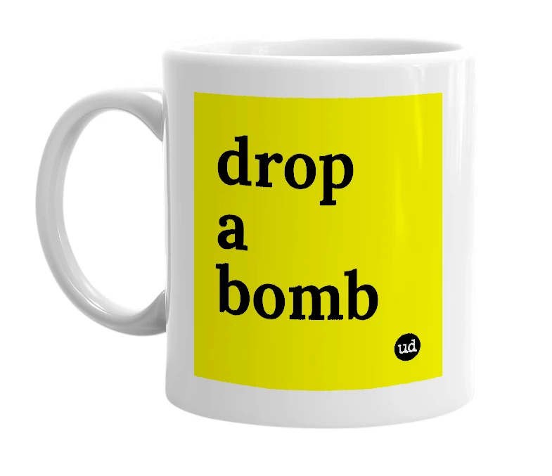 White mug with 'drop a bomb' in bold black letters