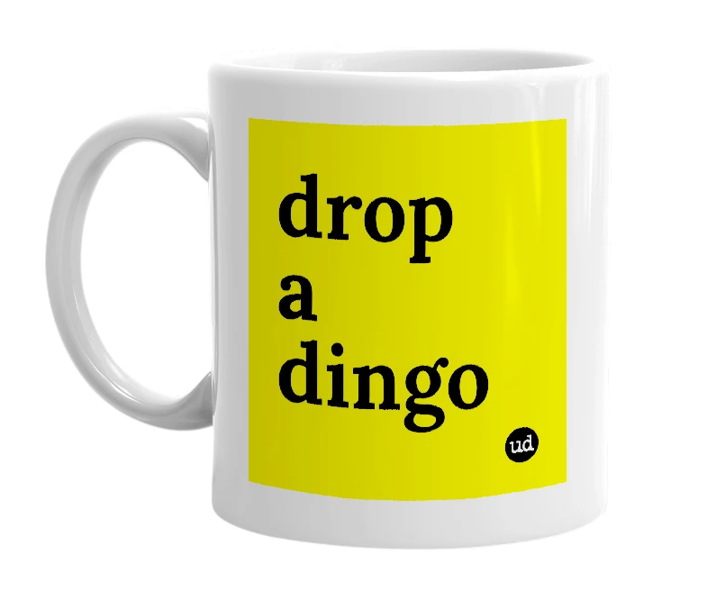 White mug with 'drop a dingo' in bold black letters