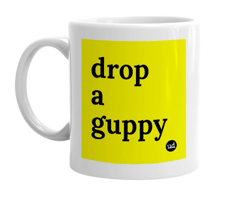 White mug with 'drop a guppy' in bold black letters