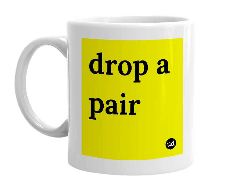 White mug with 'drop a pair' in bold black letters