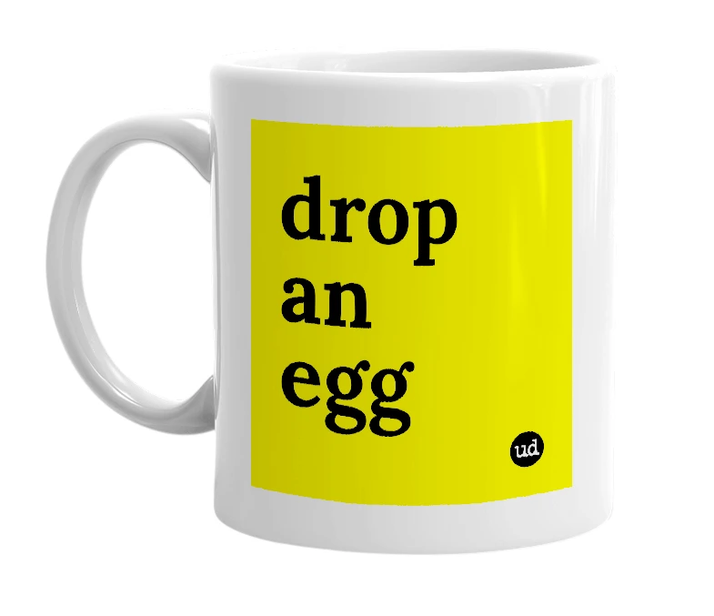 White mug with 'drop an egg' in bold black letters