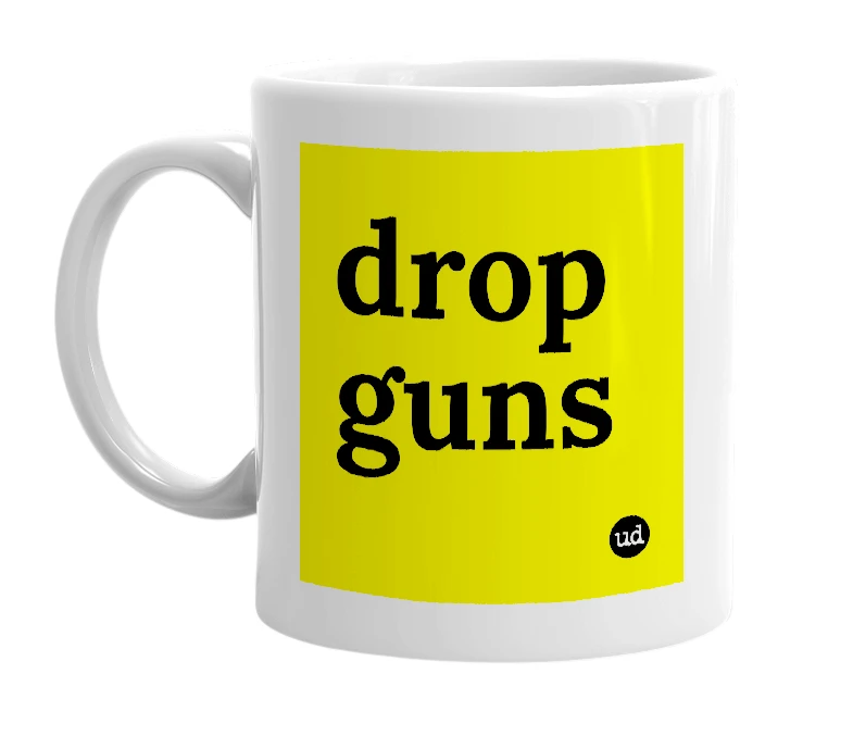White mug with 'drop guns' in bold black letters