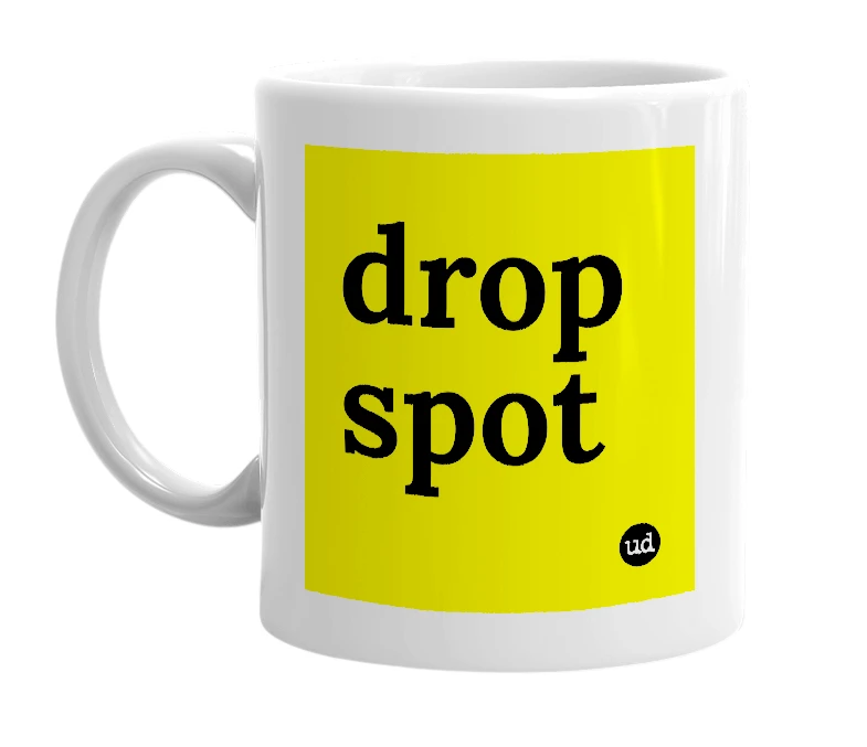 White mug with 'drop spot' in bold black letters