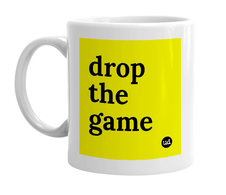 White mug with 'drop the game' in bold black letters