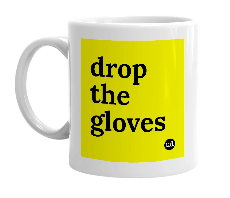 White mug with 'drop the gloves' in bold black letters