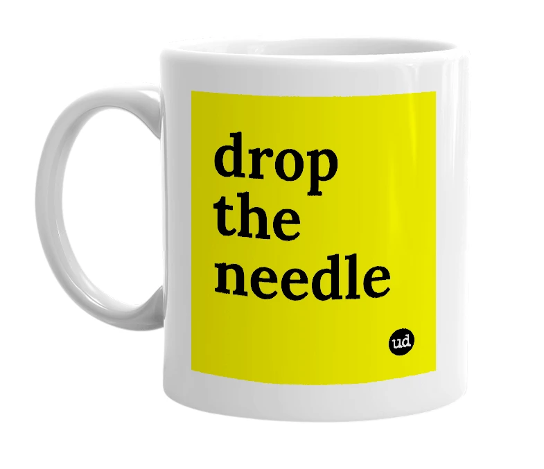 White mug with 'drop the needle' in bold black letters