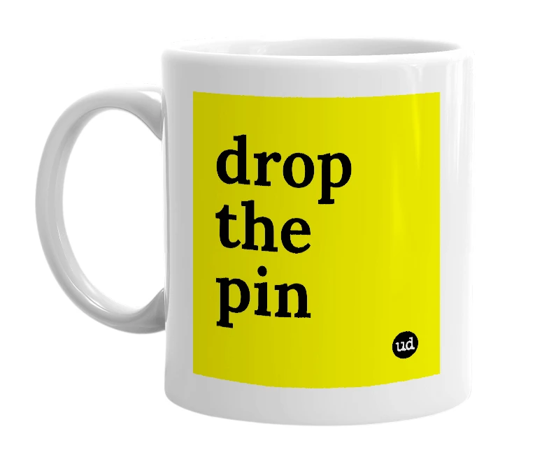 White mug with 'drop the pin' in bold black letters