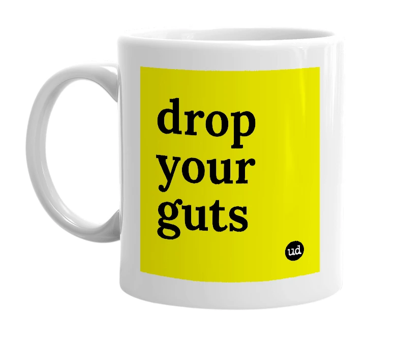 White mug with 'drop your guts' in bold black letters