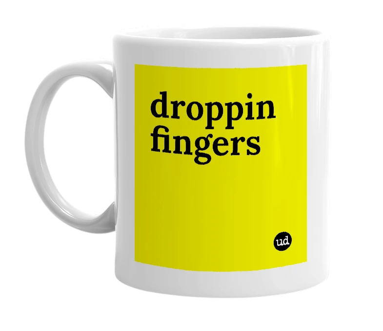 White mug with 'droppin fingers' in bold black letters