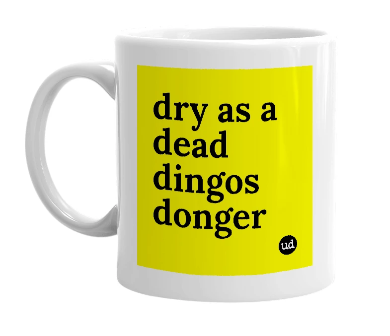 White mug with 'dry as a dead dingos donger' in bold black letters