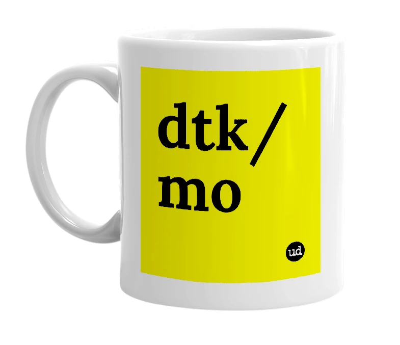 White mug with 'dtk/mo' in bold black letters