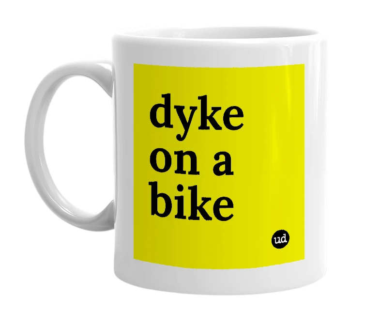 White mug with 'dyke on a bike' in bold black letters