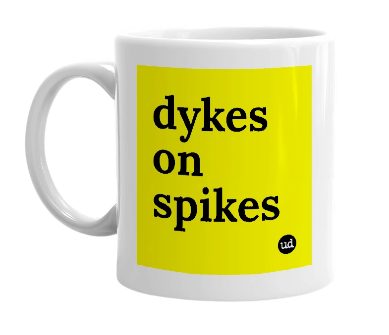 White mug with 'dykes on spikes' in bold black letters