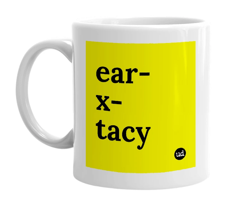 White mug with 'ear-x-tacy' in bold black letters