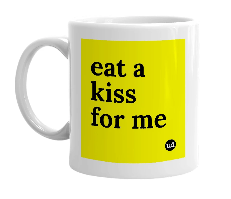 White mug with 'eat a kiss for me' in bold black letters