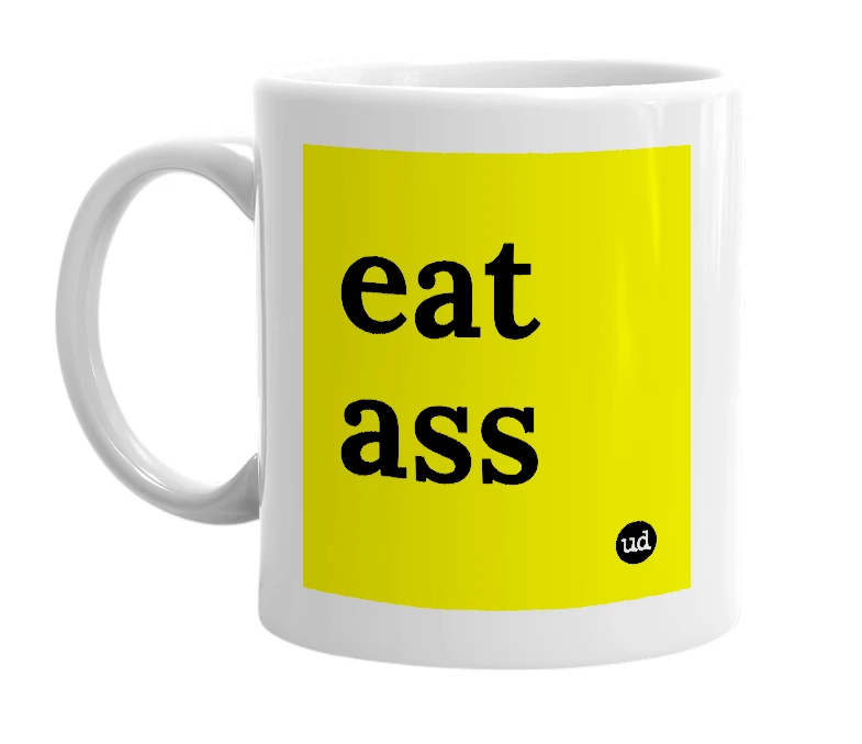 White mug with 'eat ass' in bold black letters