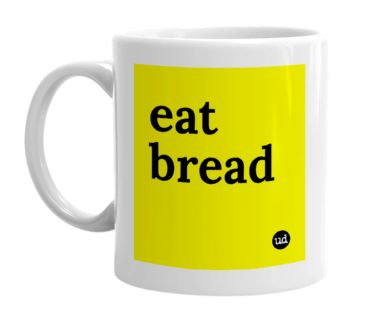 White mug with 'eat bread' in bold black letters