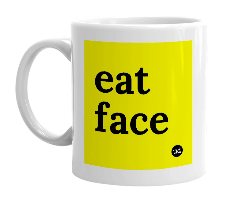 White mug with 'eat face' in bold black letters