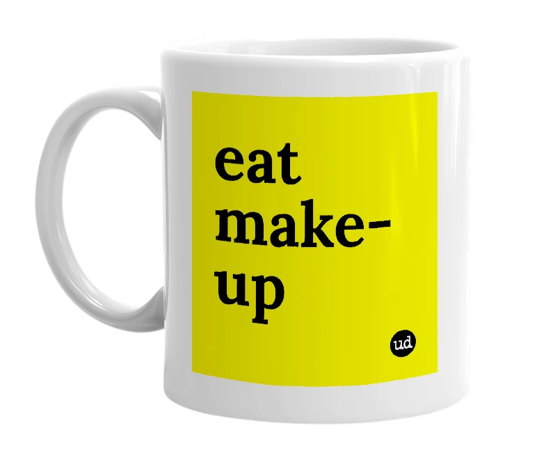 White mug with 'eat make-up' in bold black letters