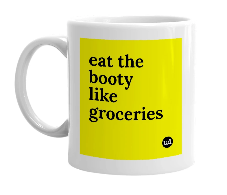 White mug with 'eat the booty like groceries' in bold black letters