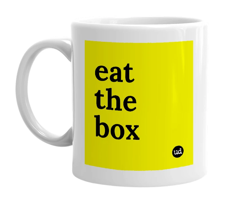 White mug with 'eat the box' in bold black letters