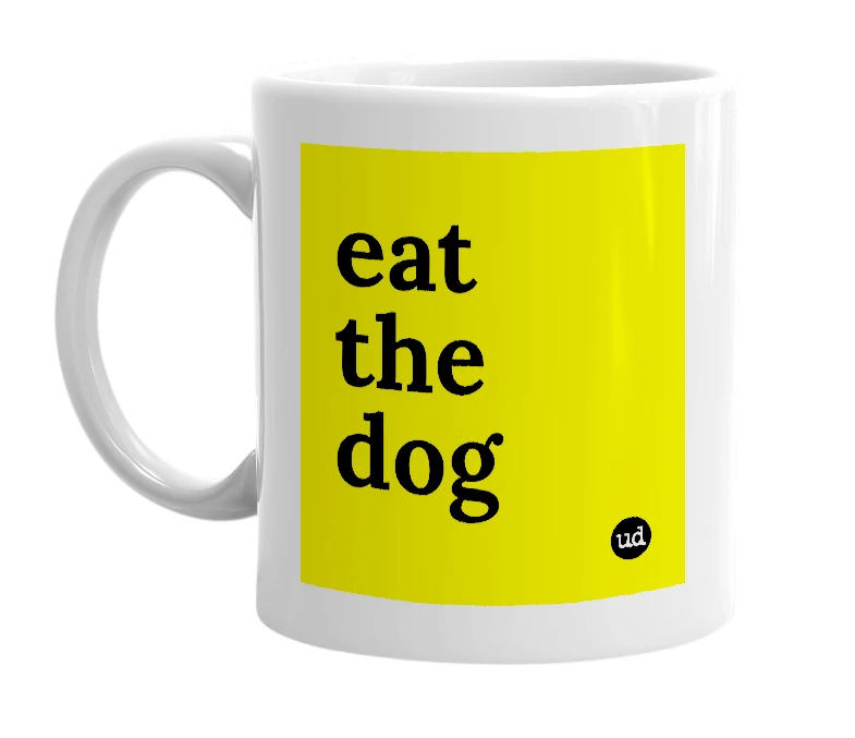 White mug with 'eat the dog' in bold black letters