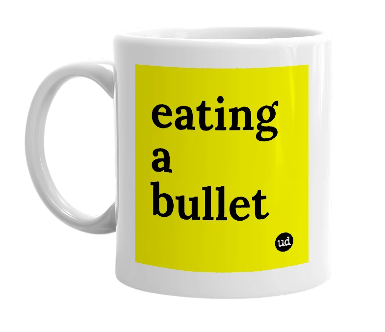 White mug with 'eating a bullet' in bold black letters