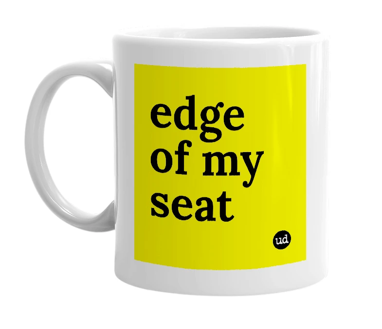 White mug with 'edge of my seat' in bold black letters